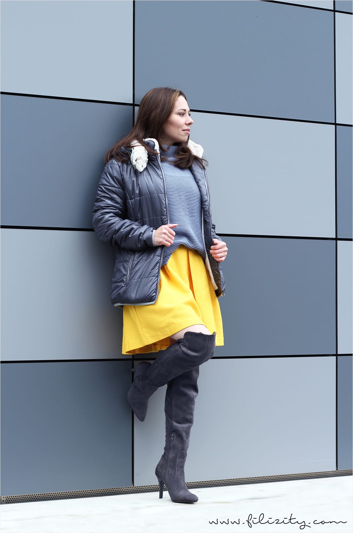 winter look with yellow skirt, overknee boots and knit sweater